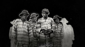 Movie still from “13th” (2016), directed by Ava DuVernay – A black and white photo of a group of young men; Wide shot, High angle