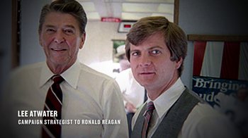 Movie still from “13th” (2016), directed by Ava DuVernay – Two men standing next to each other wearing ties; Medium shot, Over the shoulder angle