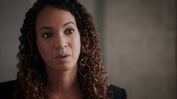 Movie still from “13th” (2016), directed by Ava DuVernay – A person with curly hair; Close Up shot, Over the shoulder angle