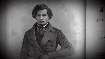 Movie still from “13th” (2016), directed by Ava DuVernay – An old photo of a man in a suit; Close Up shot, High angle