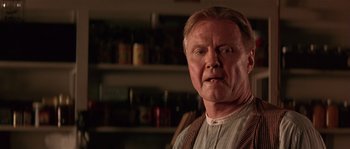 Movie still from “Rosewood” (1997), directed by John Singleton – An older man in a white shirt and a brown tie; Close Up shot, Low angle