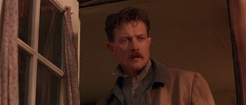 Movie still from “Rosewood” (1997), directed by John Singleton – A person with a mustache; Close Up shot, Low angle