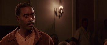 Movie still from “Rosewood” (1997), directed by John Singleton – A man standing in front of a group of people; Close Up shot, Over the shoulder angle