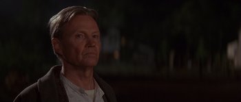 Movie still from “Rosewood” (1997), directed by John Singleton – A person wearing a jacket; Close Up shot, Low angle