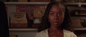 Movie still from “Rosewood” (1997), directed by John Singleton – A person wearing a white shirt; Close Up shot, Over the shoulder angle