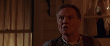 Movie still from “Rosewood” (1997), directed by John Singleton – An older man stares into the camera; Close Up shot, Low angle