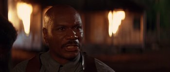 Movie still from “Rosewood” (1997), directed by John Singleton – A person wearing a suit and tie; Close Up shot, Low angle