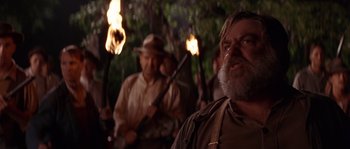 Movie still from “Rosewood” (1997), directed by John Singleton – A group of men standing next to each other holding torches; Close Up shot, Low angle