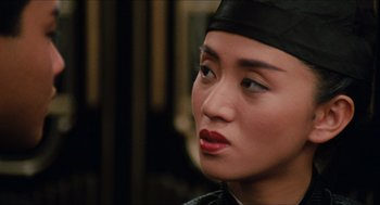 Movie still from “Rouge” (1987), directed by Stanley Kwan – A person wearing a hat; Close Up shot, Over the shoulder angle