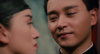 Movie still from “Rouge” (1987), directed by Stanley Kwan – Two people looking at one another; Close Up shot, Over the shoulder angle