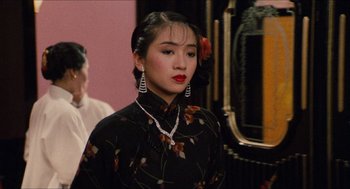 Movie still from “Rouge” (1987), directed by Stanley Kwan – A woman in a black dress with red lipstick; Close Up shot, Over the shoulder angle