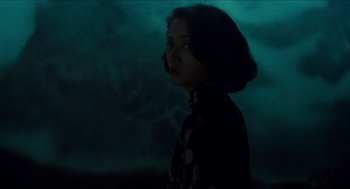 Movie still from “Rouge” (1987), directed by Stanley Kwan – A woman standing in the dark looking at the sky; Medium shot, Low angle