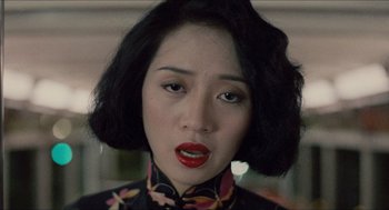 Movie still from “Rouge” (1987), directed by Stanley Kwan – A person wearing a black and red dress; Close Up shot, High angle