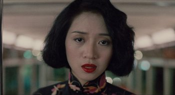 Movie still from “Rouge” (1987), directed by Stanley Kwan – A person with short black hair; Close Up shot, Over the shoulder angle