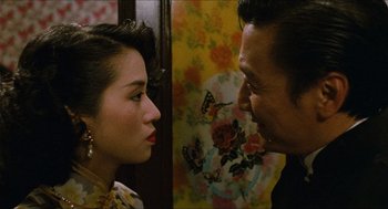 Movie still from “Rouge” (1987), directed by Stanley Kwan – A man and a woman looking at one another; Close Up shot, Over the shoulder angle