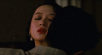 Movie still from “Rouge” (1987), directed by Stanley Kwan – A person with their eyes closed; Close Up shot, Over the shoulder angle