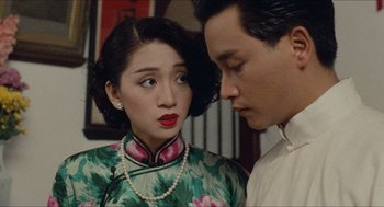 Movie still from “Rouge” (1987), directed by Stanley Kwan – A man and a woman standing next to each other; Close Up shot, Over the shoulder angle