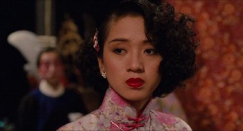 Movie still from “Rouge” (1987), directed by Stanley Kwan – A person wearing a dress; Close Up shot, Over the shoulder angle