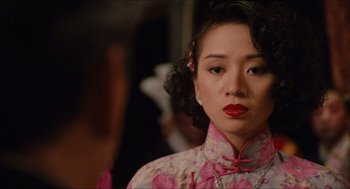 Movie still from “Rouge” (1987), directed by Stanley Kwan – A person wearing a dress; Close Up shot, Over the shoulder angle