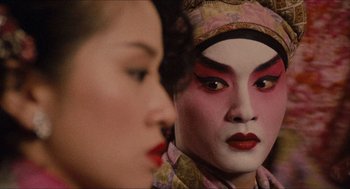 Movie still from “Rouge” (1987), directed by Stanley Kwan – A person with a face painting and a woman with a red lipstick; Close Up shot, Over the shoulder angle
