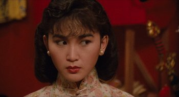 Movie still from “Rouge” (1987), directed by Stanley Kwan – A person wearing a dress; Close Up shot, Over the shoulder angle