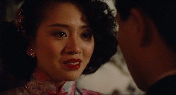 Movie still from “Rouge” (1987), directed by Stanley Kwan – A person wearing a dress; Close Up shot, Over the shoulder angle