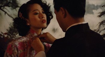 Movie still from “Rouge” (1987), directed by Stanley Kwan – A man putting a necklace on a woman's neck; Close Up shot, Over the shoulder angle