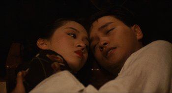 Movie still from “Rouge” (1987), directed by Stanley Kwan – A man and a woman laying on the ground; Close Up shot, Overhead angle