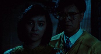Movie still from “Rouge” (1987), directed by Stanley Kwan – A man and a woman are standing next to each other; Close Up shot, Low angle