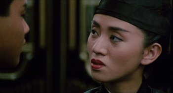 Movie still from “Rouge” (1987), directed by Stanley Kwan – A person wearing a hat; Close Up shot, Over the shoulder angle