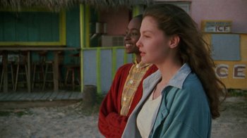 Movie still from “Ruby in Paradise” (1993), directed by Victor Nunez – Two people standing next to each other on the beach; Medium shot, Over the shoulder angle