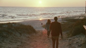 Movie still from “Ruby in Paradise” (1993), directed by Victor Nunez – A man and a woman walking down a path towards the ocean; Extreme Wide shot, Over the shoulder angle
