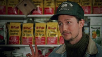 Movie still from “Ruby in Paradise” (1993), directed by Victor Nunez – A man wearing a green hat and a green sweater; Close Up shot, Over the shoulder angle