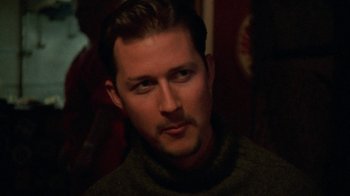 Movie still from “Ruby in Paradise” (1993), directed by Victor Nunez – A person wearing a sweater; Close Up shot, High angle