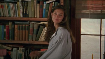 Movie still from “Ruby in Paradise” (1993), directed by Victor Nunez – A woman standing in front of a book shelf; Medium shot, Over the shoulder angle