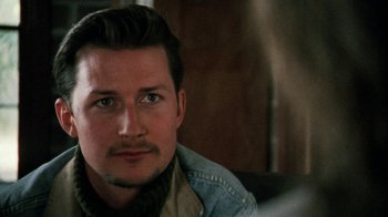 Movie still from “Ruby in Paradise” (1993), directed by Victor Nunez – A person wearing a jean jacket; Close Up shot, Over the shoulder angle