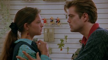 Movie still from “Ruby in Paradise” (1993), directed by Victor Nunez – A man and a woman standing next to each other; Close Up shot, Over the shoulder angle