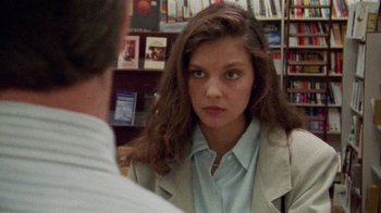 Movie still from “Ruby in Paradise” (1993), directed by Victor Nunez – A woman in a beige jacket is talking to a man in a white shirt; Close Up shot, Over the shoulder angle