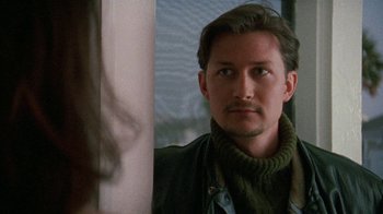 Movie still from “Ruby in Paradise” (1993), directed by Victor Nunez – A person wearing a jacket; Close Up shot, Over the shoulder angle
