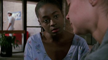 Movie still from “Ruby in Paradise” (1993), directed by Victor Nunez – A woman in a floral shirt is looking at a man in a blue shirt; Close Up shot, Over the shoulder angle