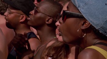 Movie still from “Ruby in Paradise” (1993), directed by Victor Nunez – A group of young men and women at an outdoor event; Close Up shot, High angle