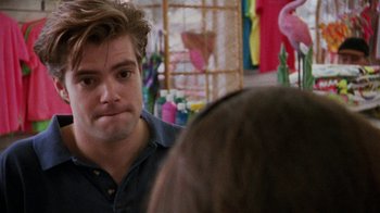 Movie still from “Ruby in Paradise” (1993), directed by Victor Nunez – A young man sitting in front of a woman in a store; Close Up shot, Over the shoulder angle