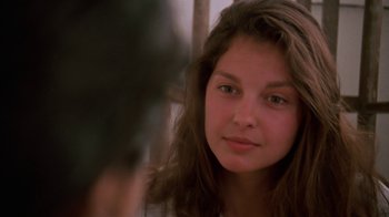 Movie still from “Ruby in Paradise” (1993), directed by Victor Nunez – A young woman is looking at the camera; Close Up shot, Over the shoulder angle