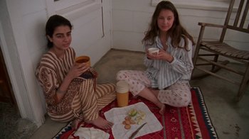 Movie still from “Ruby in Paradise” (1993), directed by Victor Nunez – Two women sitting on the floor drinking coffee; Medium shot, High angle