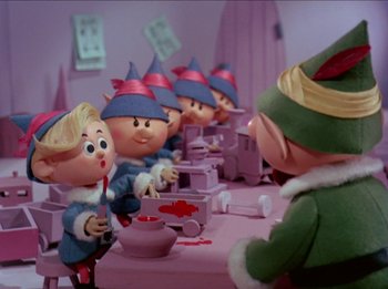 Movie still from “Rudolph the Red-Nosed Reindeer” (1964), directed by Larry Roemer – A group of people in a room next to each other; Medium shot, Low angle