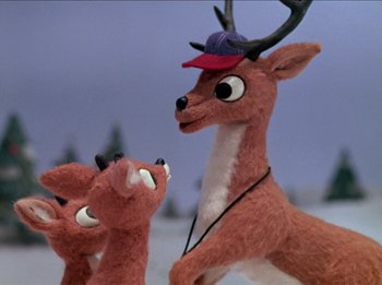 Movie still from “Rudolph the Red-Nosed Reindeer” (1964), directed by Larry Roemer – Two stuffed animals with a hat on their heads; Close Up shot, Low angle