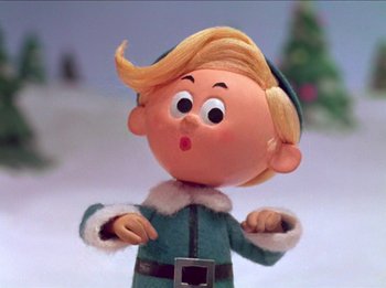 Movie still from “Rudolph the Red-Nosed Reindeer” (1964), directed by Larry Roemer – A figurine of an elf with a surprised look on his face; Close Up shot, Low angle