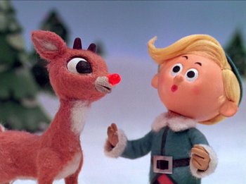Movie still from “Rudolph the Red-Nosed Reindeer” (1964), directed by Larry Roemer – Rudolph the red nosed reindeer and the elf on the shelf; Close Up shot, Low angle