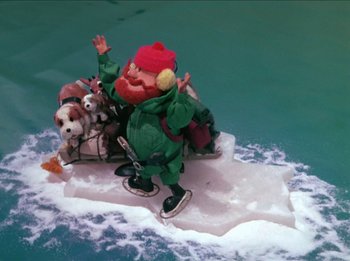 Movie still from “Rudolph the Red-Nosed Reindeer” (1964), directed by Larry Roemer – An ice skating gnome on the ice; Wide shot, High angle