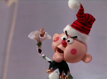 Movie still from “Rudolph the Red-Nosed Reindeer” (1964), directed by Larry Roemer – A cartoon character wearing a santa hat; Close Up shot, Low angle